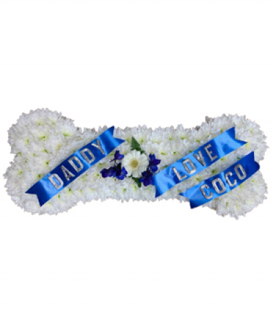 Dog Bone Tribute - An adorable tribute from their best friend, this chrysanthemum-based dog bone design can be customised with your choice of wording and is finished with a simple flower spray